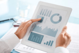 physician looking at data on tablet