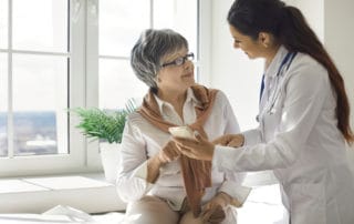 physician helping patient with treatment options