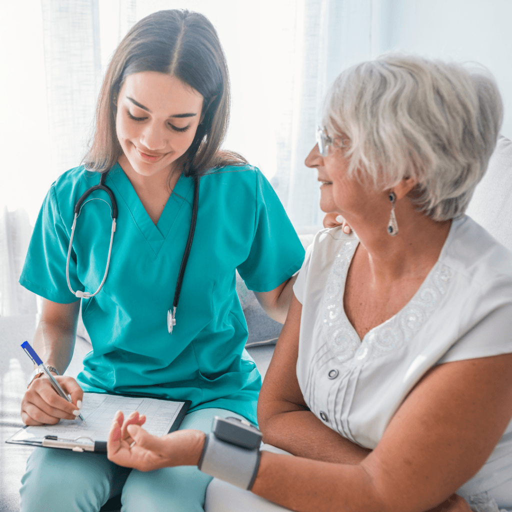 Nurse recording heart rate of older patient