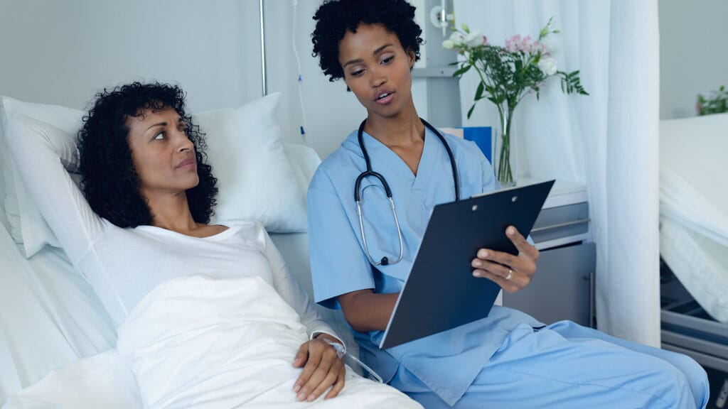 Doctor sitting with patient